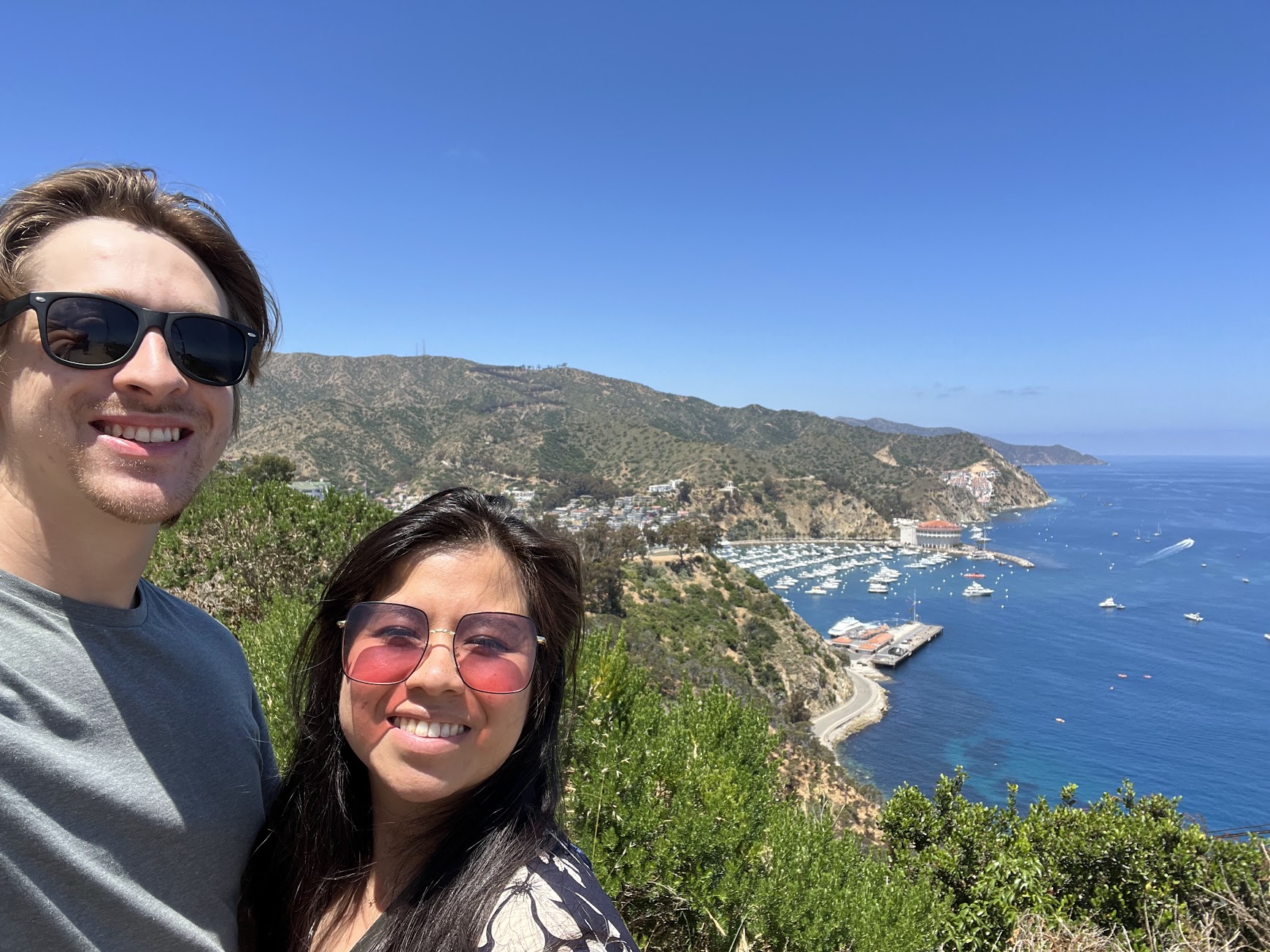 Stephanie and Brandon selfie in front of the Catalina Island bay