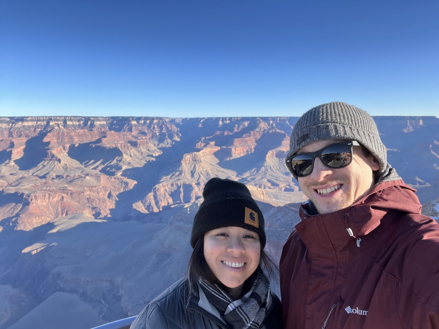 Stephanie and Brandon posing with the Grand Canyon