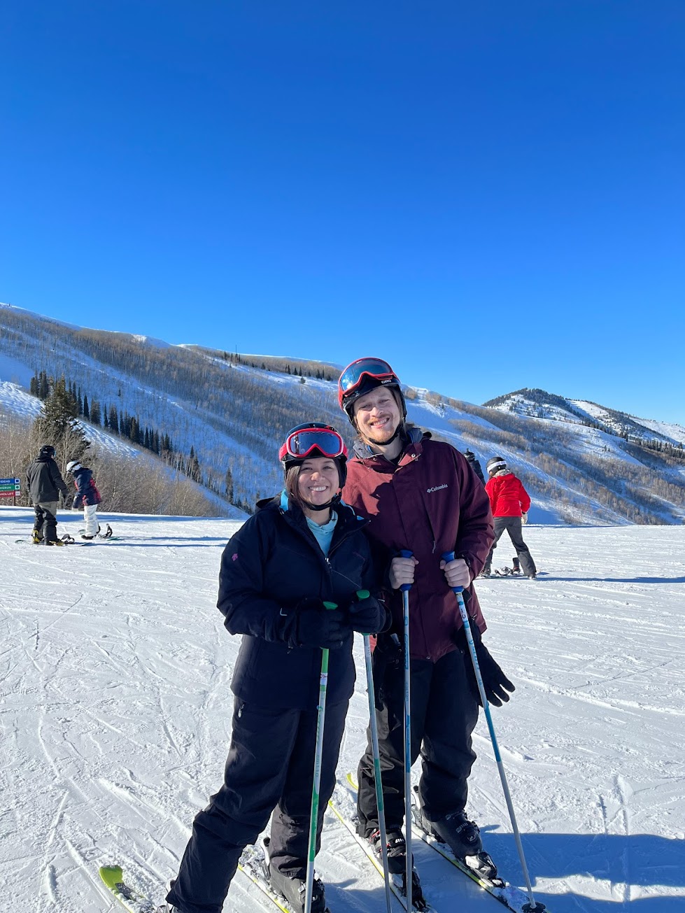 Stephanie and Brandon posing in ski gear in Park City, Utah